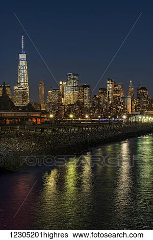 Stock Photograph - Manhattan skyline at twilight, Liberty State Park; Jersey City, New Jersey, United States of America. Fotosearch