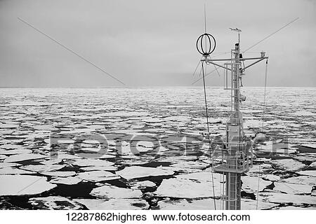 Mast Of A Ship In The Sea Filled With Floating Ice; Spitsbergen, Svalbard, Norway View Large Photo Image Stock Photograph - Mast Of A Ship In The Sea Filled With Floating Ice; Spitsbergen, Svalbard, Norway. Fotosearch