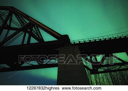Mears Memorial Bridge and the Northern lights; Alaska, United States of America View Large Photo Image Stock Photograph - Mears Memorial Bridge and the Northern lights; Alaska, United States of America. Fotosearch
