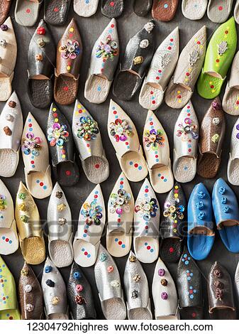 Stock Photograph - Medina souk sandal shop; Marrakech, Morocco. Fotosearch