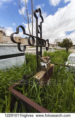 Metal cross headstone with overgrown grass in a cemetery; Israel View Large Photo Image Stock Photograph - Metal cross headstone with overgrown grass in a cemetery; Israel. Fotosearch
