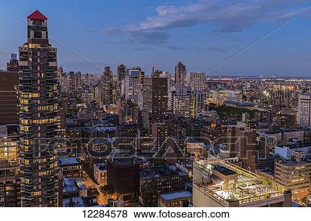 Midtown Manhattan at twilight; New York City, New York, United States of America View Large Photo Image Stock Photo - Midtown Manhattan at twilight; New York City, New York, United States of America. Fotosearch