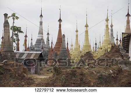 Mixed new and old stupas in this small village up a tributary off Inle Lake; Myanmar View Large Photo Image Stock Image - Mixed new and old stupas in this small village up a tributary off Inle Lake; Myanmar. Fotosearch