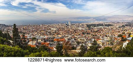 Stock Photograph - Modern day Izmir, a major port on the Aegean Sea, and the remains of Smyrna; Izmir, Turkey. Fotosearch