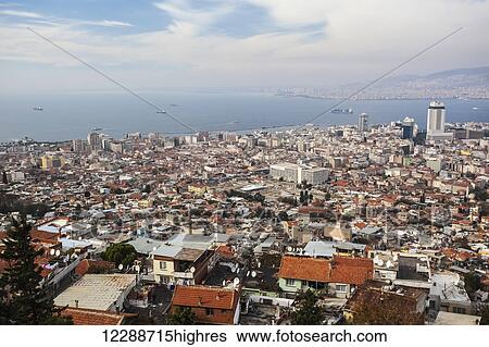 Stock Photograph - Modern day Izmir, with a busy port on the Aegean Sea; Izmir, Turkey. Fotosearch