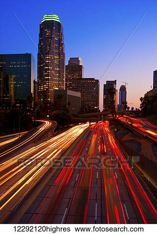 Stock Photograph - Modern Urban City at Sunset. Fotosearch