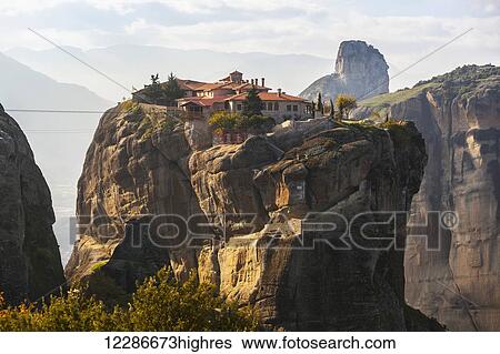 Stock Photograph - Monastery on the edge of a cliff; Meteora, Greece. Fotosearch