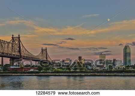 Moonrise over Queensboro (59th Street) Bridge and the Citibank Building; Queens, New York, United States of America View Large Photo Image Stock Photo - Moonrise over Queensboro (59th Street) Bridge and the Citibank Building; Queens, New York, United States of America. Fotosearch