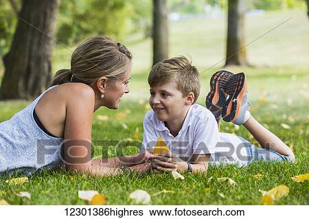 Mother spending quality time with her son at a park; Edmonton, Alberta, Canada View Large Photo Image Stock Photograph - Mother spending quality time with her son at a park; Edmonton, Alberta, Canada. Fotosearch
