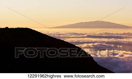 Stock Photograph - Mountain Top above the Clouds. Fotosearch