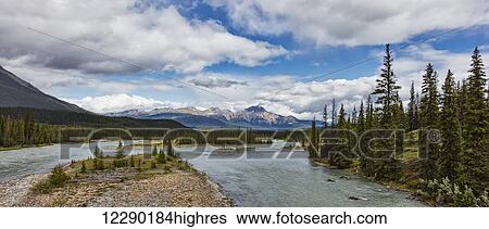 Stock Photograph - Mountain view along the Athabasca river, Jasper National Park; Jasper, Alberta, Canada. Fotosearch