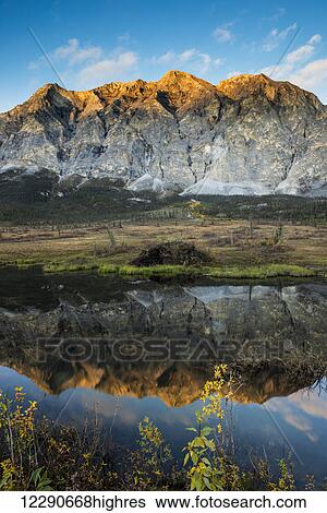 Mt. Sukakpak catches the last light of the evening north of Wiseman, in the Brooks Range, Arctic Alaska. View Large Photo Image Stock Photograph - Mt. Sukakpak catches the last light of the evening north of Wiseman, in the Brooks Range, Arctic Alaska.. Fotosearch