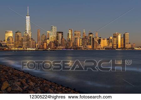 Stock Photograph - New York City skyline at sunset, Liberty State Park; Jersey City, New Jersey, United States of America. Fotosearch