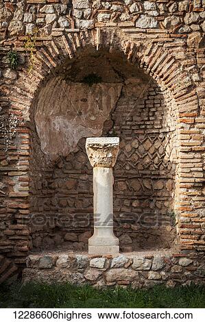 Niche in a stone wall with column and capitol; Delphi, Greece View Large Photo Image Stock Photograph - Niche in a stone wall with column and capitol; Delphi, Greece. Fotosearch