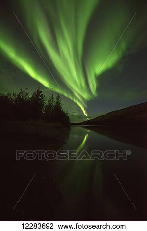 Northern Lights (aurora borealis) over the Pelly River; Ross River, Yukon, Canada View Large Photo Image Stock Image - Northern Lights (aurora borealis) over the Pelly River; Ross River, Yukon, Canada. Fotosearch
