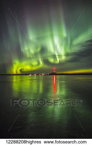 Stock Photograph - Northern Lights over frozen Big Lake, Southcentral Alaska, winter. Fotosearch