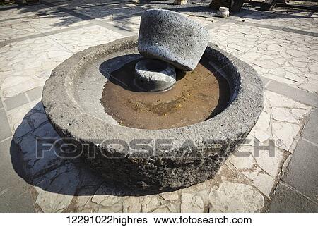 Stock Photograph - Old millstone; Tabgha, Israel. Fotosearch
