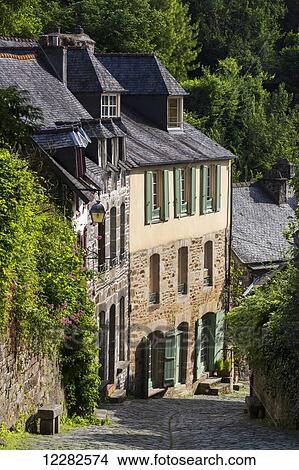 Old stone buildings with green shutters down a cobblestone road; Dinan, Brittany, France View Large Photo Image Picture - Old stone buildings with green shutters down a cobblestone road; Dinan, Brittany, France. Fotosearch