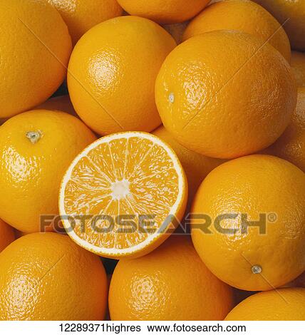 Oranges with one cut in half on top of pile; Toronto, Ontario, Canada View Large Photo Image Stock Photograph - Oranges with one cut in half on top of pile; Toronto, Ontario, Canada. Fotosearch