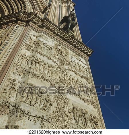Stock Photograph - Ornate facade of a wall; Orvieto, Umbria, Italy. Fotosearch