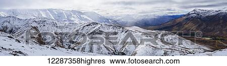Stock Photograph - Panoramic view of the Dempster Highway looking south from the top of Goldensides mountain; Yukon, Canada. Fotosearch