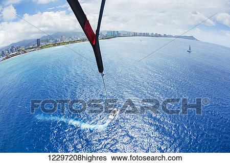Parasailing Over Ocean in Hawaii, View from up in the Sky View Large Photo Image Stock Photograph - Parasailing Over Ocean in Hawaii, View from up in the Sky. Fotosearch