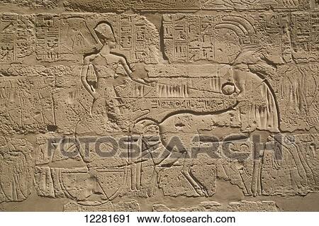 Stock Image - Pharaoh Tuthmose III on a chariot, Karnak Temple Complex; Luxor, Egypt. Fotosearch