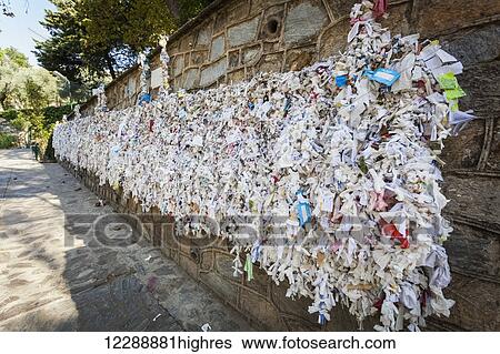 Stock Photograph - Pieces of cloth on a prayer wall; Ephesus, Turkey. Fotosearch