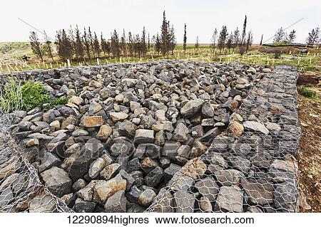Stock Photograph - Pile of rocks and rubble at the site of a Syrian army bunker; Golan Heights, Israel. Fotosearch