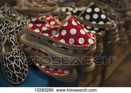 Polka dot and animal pattern espadrilles, a modern version of traditional Basque form of footwear, for sale in a souvenir shop; San Sebastian, Spain View Large Photo Image Stock Photography - Polka dot and animal pattern espadrilles, a modern version of traditional Basque form of footwear, for sale in a souvenir shop; San Sebastian, Spain. Fotosearch