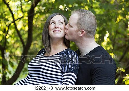 Stock Photo - Portrait of a couple expecting a baby; Langley, British Columbia, Canada. Fotosearch