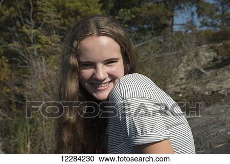 Portrait of a girl with long blond hair; Lake of the Woods, Ontario, Canada View Large Photo Image Stock Image - Portrait of a girl with long blond hair; Lake of the Woods, Ontario, Canada. Fotosearch
