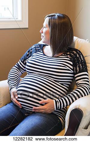 Stock Image - Portrait of a pregnant woman; Langley, British Columbia, Canada. Fotosearch
