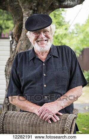 Portrait of a senior man with beard, hat, and eyeglasses; Maple Ridge, British Columbia, Canada View Large Photo Image Stock Image - Portrait of a senior man with beard, hat, and eyeglasses; Maple Ridge, British Columbia, Canada. Fotosearch