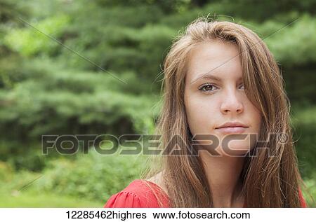 Stock Photograph - Portrait of a teenage girl outdoors. Fotosearch