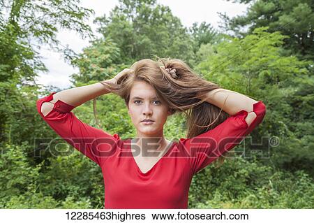 Stock Photograph - Portrait of a teenage girl outdoors. Fotosearch