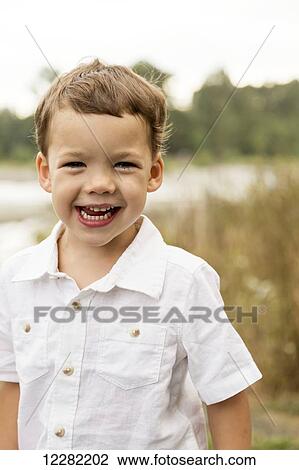 Stock Image - Portrait of a young boy; Chilliwack, British Columbia, Canada. Fotosearch