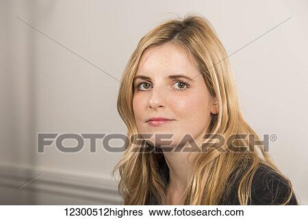 Portrait of a young business woman with long blond hair; England View Large Photo Image Stock Photograph - Portrait of a young business woman with long blond hair; England. Fotosearch