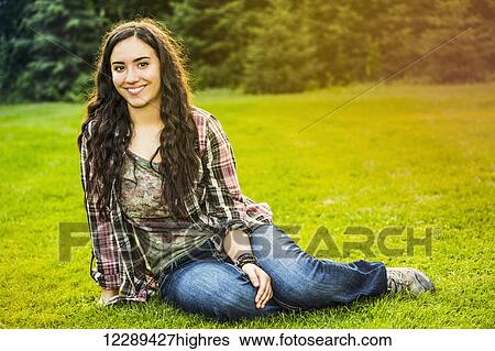 Portrait of a young woman outdoors at sunset; Sherwood Park, Alberta, Canada View Large Photo Image Stock Photograph - Portrait of a young woman outdoors at sunset; Sherwood Park, Alberta, Canada. Fotosearch