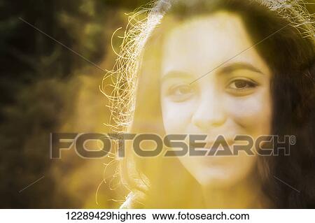 Portrait of a young woman outdoors at sunset; Sherwood Park, Alberta, Canada View Large Photo Image Stock Photograph - Portrait of a young woman outdoors at sunset; Sherwood Park, Alberta, Canada. Fotosearch