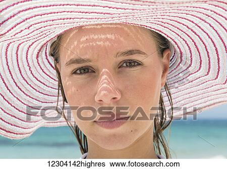 Portrait of a young woman wearing a red and white striped sunhat; Tarifa, Cadiz, Andalusia, Spain View Large Photo Image Stock Photograph - Portrait of a young woman wearing a red and white striped sunhat; Tarifa, Cadiz, Andalusia, Spain. Fotosearch