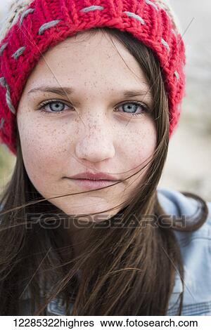 Portrait of a young woman with freckles, blue eyes and long brown hair; Tarifa, Cadiz, Andalusia, Spain View Large Photo Image Stock Photograph - Portrait of a young woman with freckles, blue eyes and long brown hair; Tarifa, Cadiz, Andalusia, Spain. Fotosearch