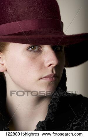 Portrait of redhead in ribboned maroon hat; Caldecott, England View Large Photo Image Stock Photograph - Portrait of redhead in ribboned maroon hat; Caldecott, England. Fotosearch