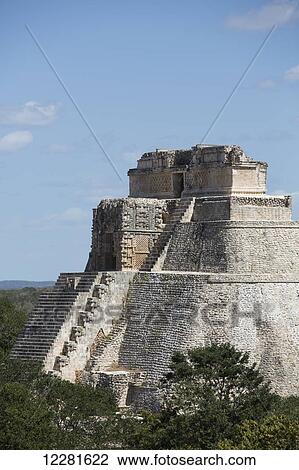 Stock Image - Pyramid of the Magician, Uxmal Mayan archaeological site; Yucatan, Mexico. Fotosearch