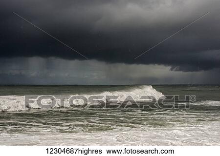Rain falls on the surf; Seaside, Oregon, United States of America View Large Photo Image Stock Photograph - Rain falls on the surf; Seaside, Oregon, United States of America. Fotosearch