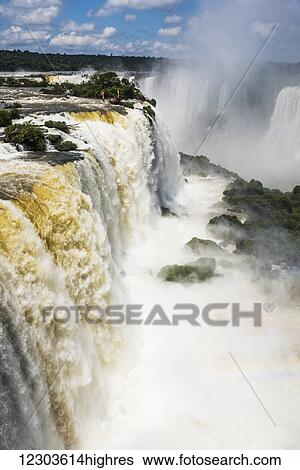 Rainbow seen in spray at Iguazu Falls; Parana, Brazil View Large Photo Image Stock Photograph - Rainbow seen in spray at Iguazu Falls; Parana, Brazil. Fotosearch