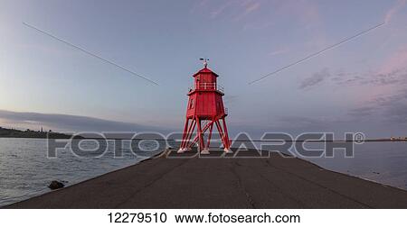 Red lighthouse along the coast at sunset; South Shields, Tyne and Wear, England View Large Photo Image Stock Image - Red lighthouse along the coast at sunset; South Shields, Tyne and Wear, England. Fotosearch