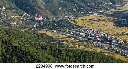River and buildings in the Paro Valley with a view of Rinpung Dzong; Paro, Bhutan View Large Photo Image Stock Photo - River and buildings in the Paro Valley with a view of Rinpung Dzong; Paro, Bhutan. Fotosearch