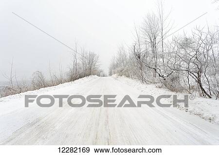 Road during winter blizzard; Caledon, Ontario, Canada View Large Photo Image Stock Photo - Road during winter blizzard; Caledon, Ontario, Canada. Fotosearch