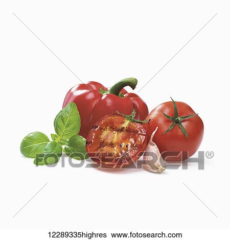 Roasted tomato with garlic, red bell pepper and basil leaves on a white background; Toronto, Ontario, Canada View Large Photo Image Stock Photograph - Roasted tomato with garlic, red bell pepper and basil leaves on a white background; Toronto, Ontario, Canada. Fotosearch